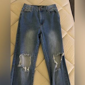 Ripped at the knee blue jeans